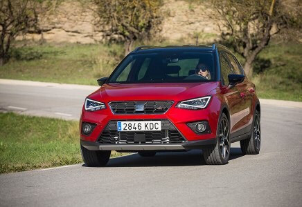 SEAT Arona driving on the road natural landscape