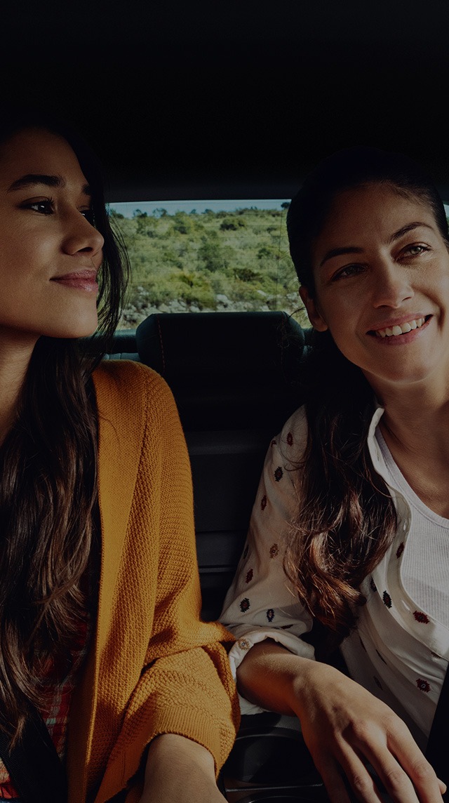 women sitting in seat arona