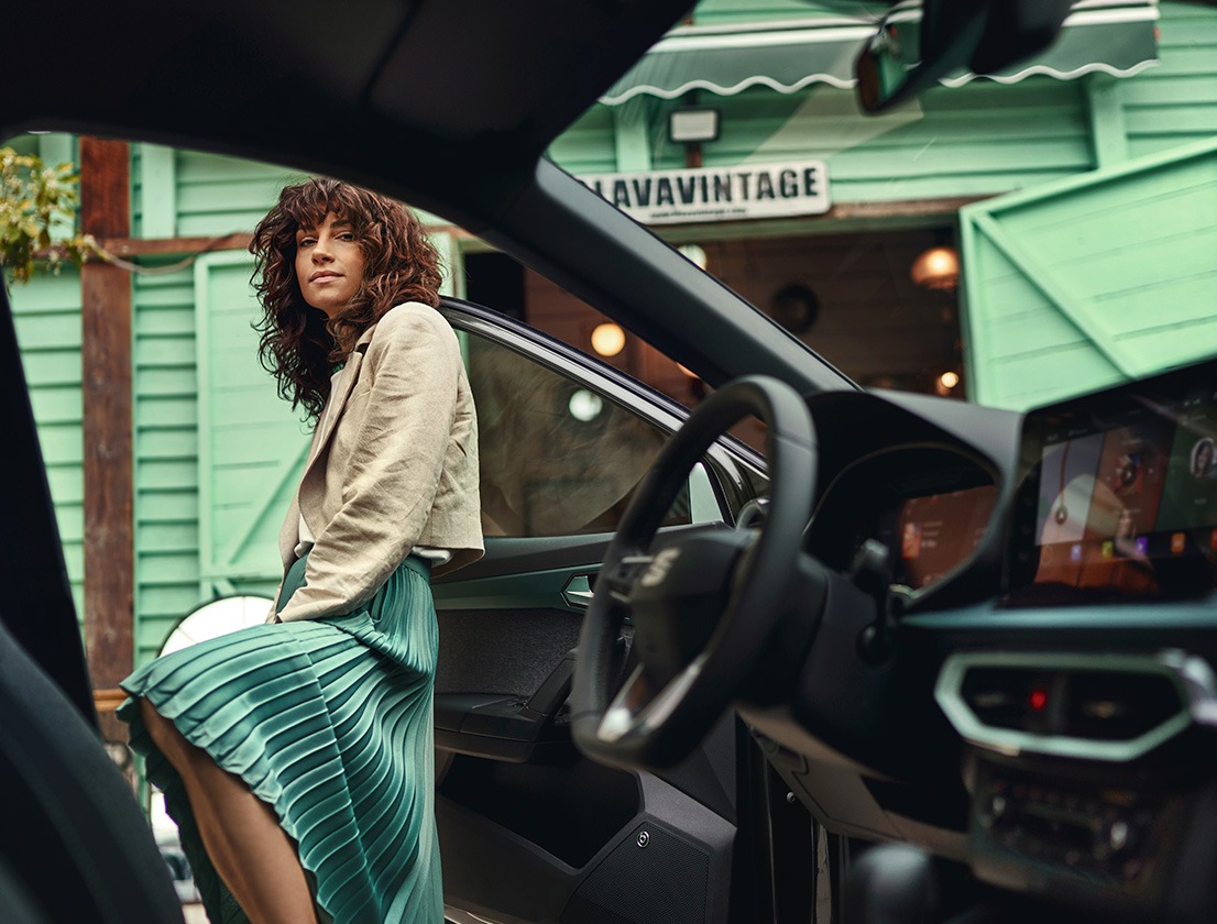 woman entering seat arona steering wheel digital cockpit