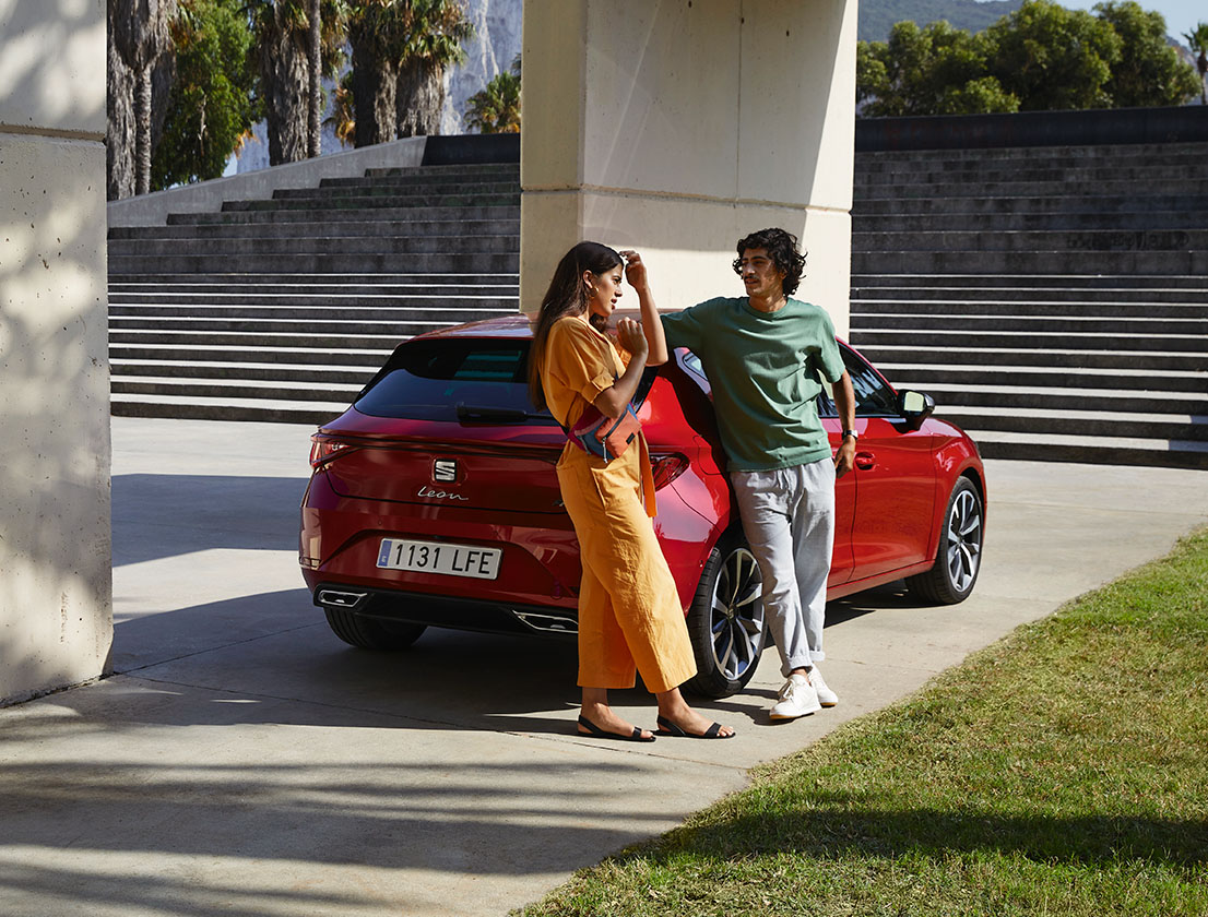 Couple laying back on the new seat leon desire red colour 