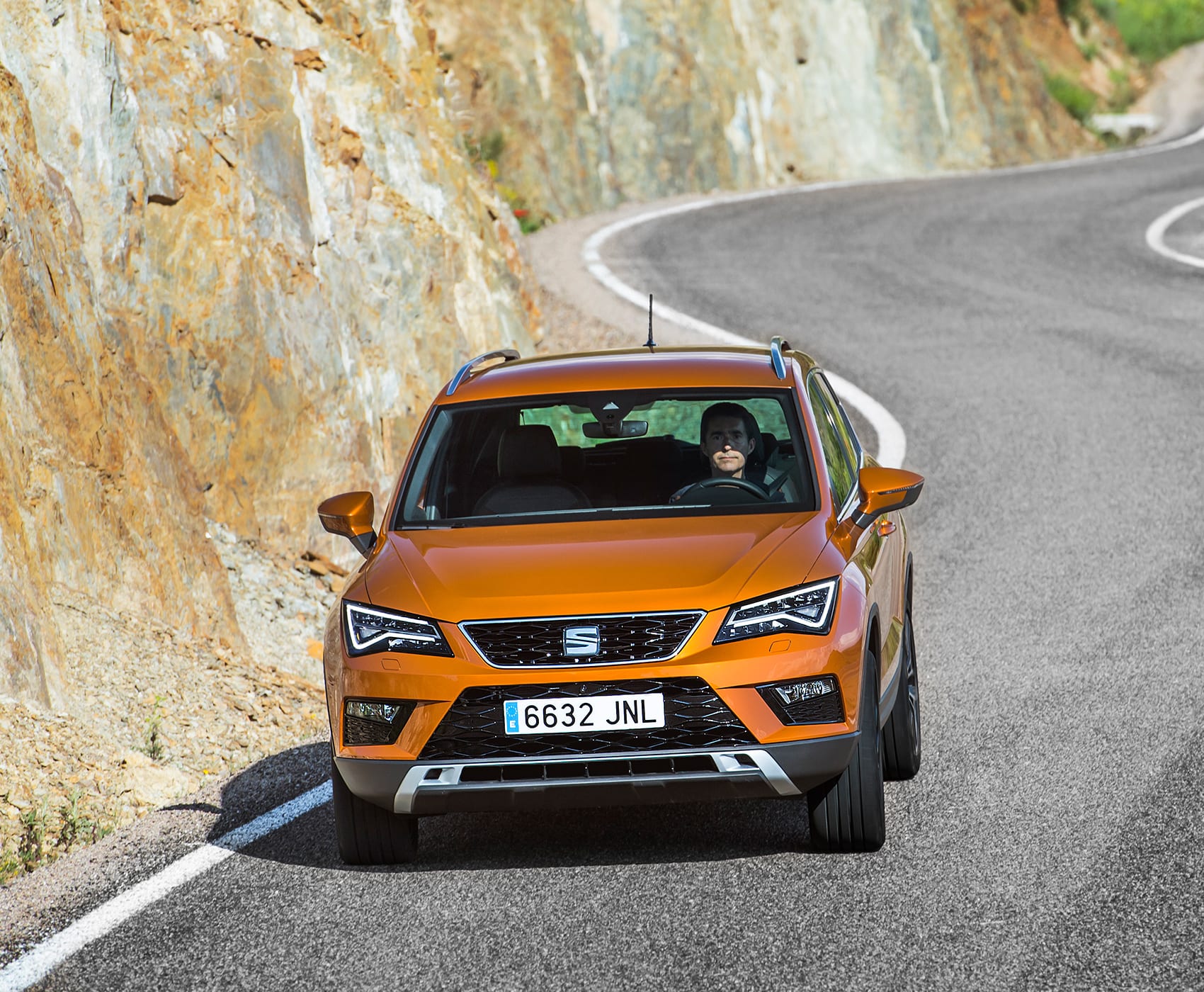 SEAT Arona front view on road color orange eclipse