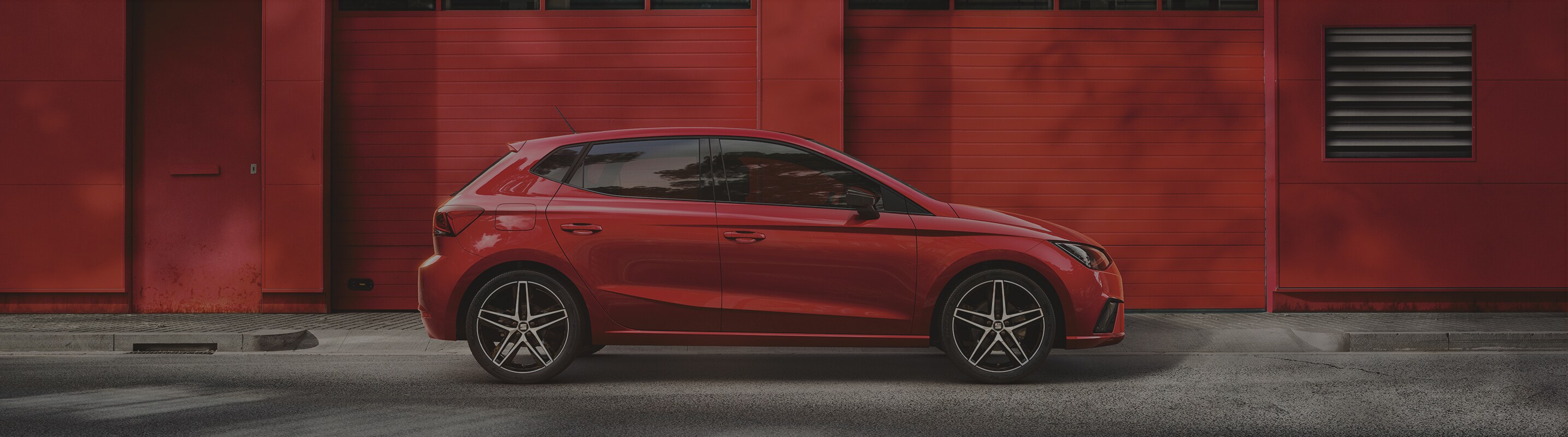SEAT Ibiza desire red side view