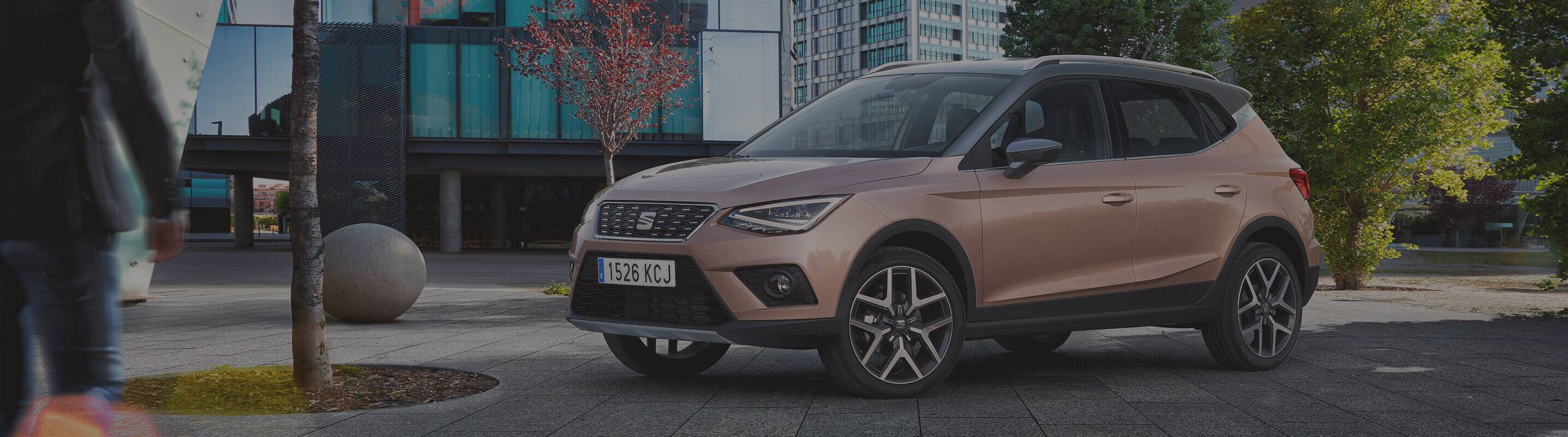 SEAT Arona parked at the city people walking around