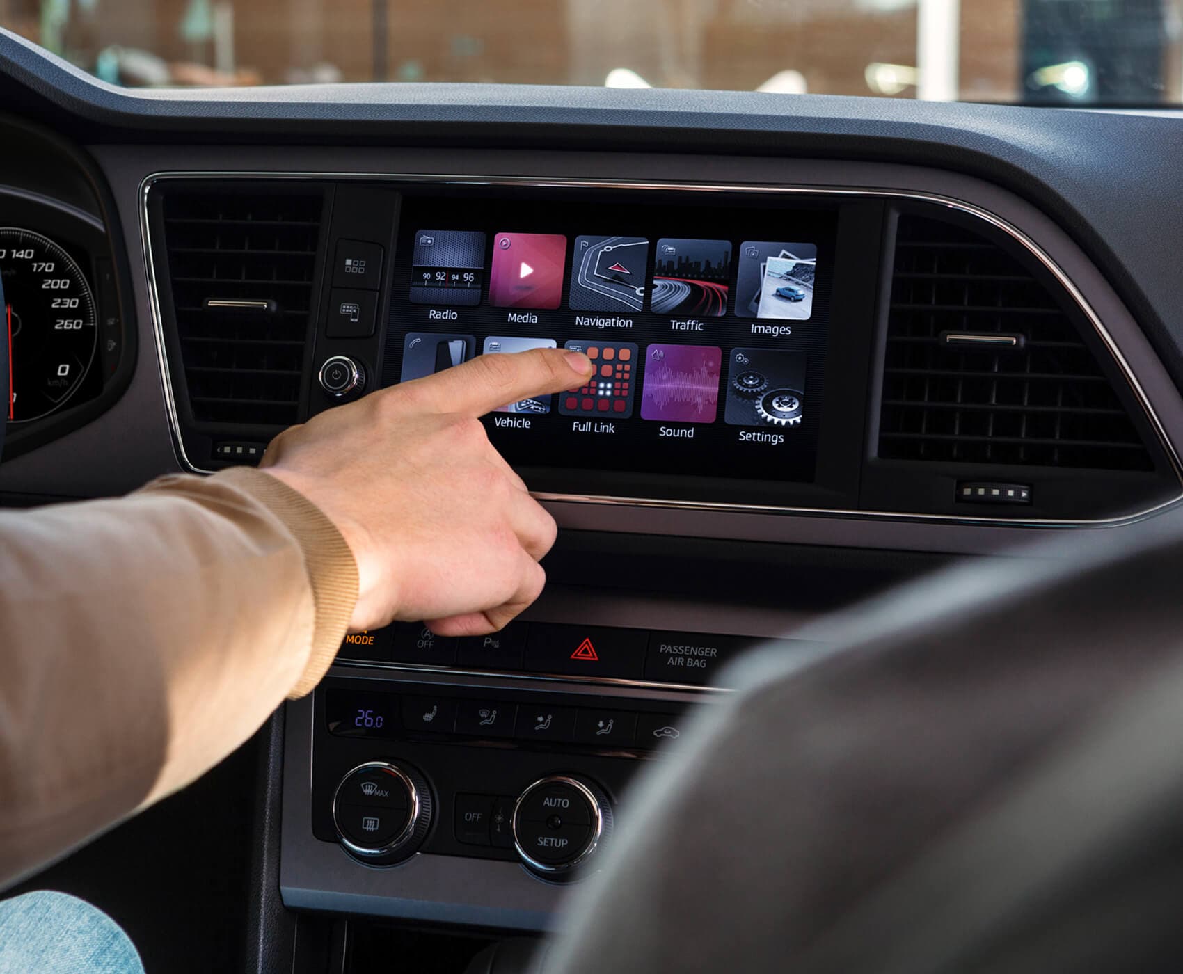 SEAT new car services and maintenance – driving pushing a button on the Navi System sat nav dashboard