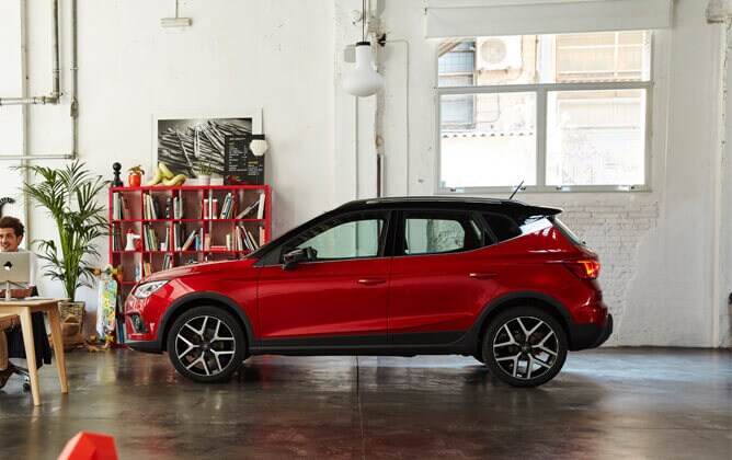 SEAT Arona crossover SUV parked inside modern scene