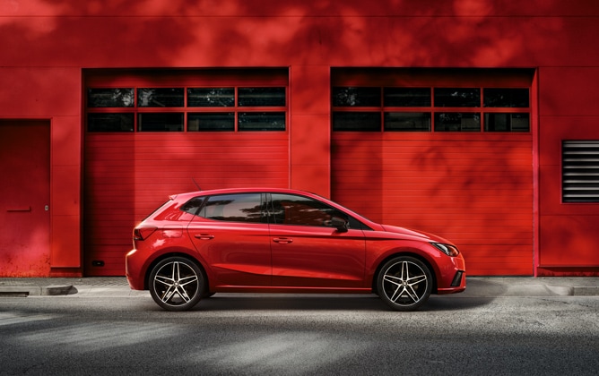 SEAT Ibiza parked outside in a red scene behind